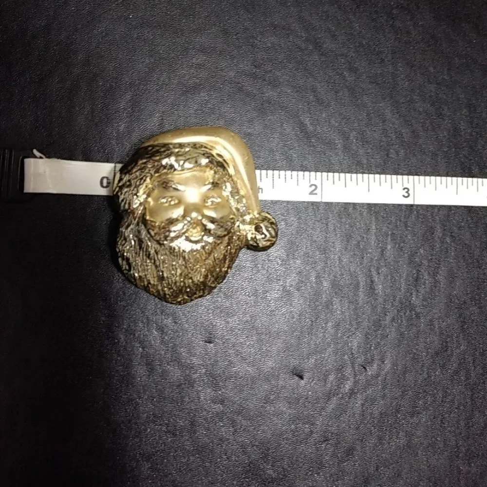 Gold tone vintage Santa Claus brooch